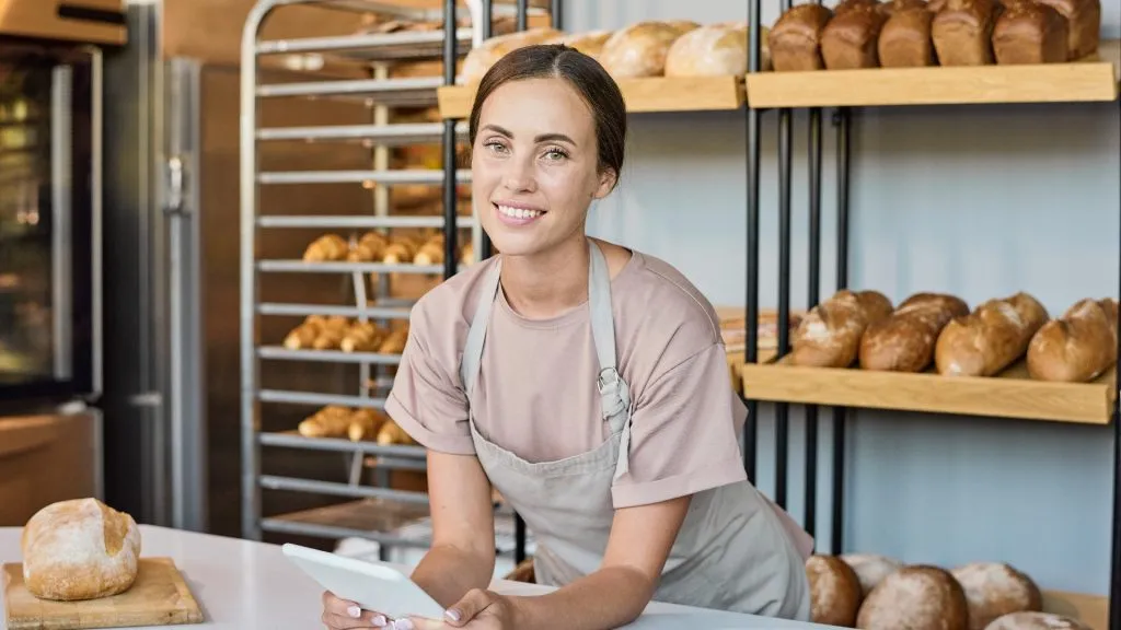 Young female clerk at a bakery