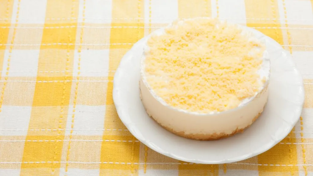 lemon cheesecake on a yellow gingham tablecloth