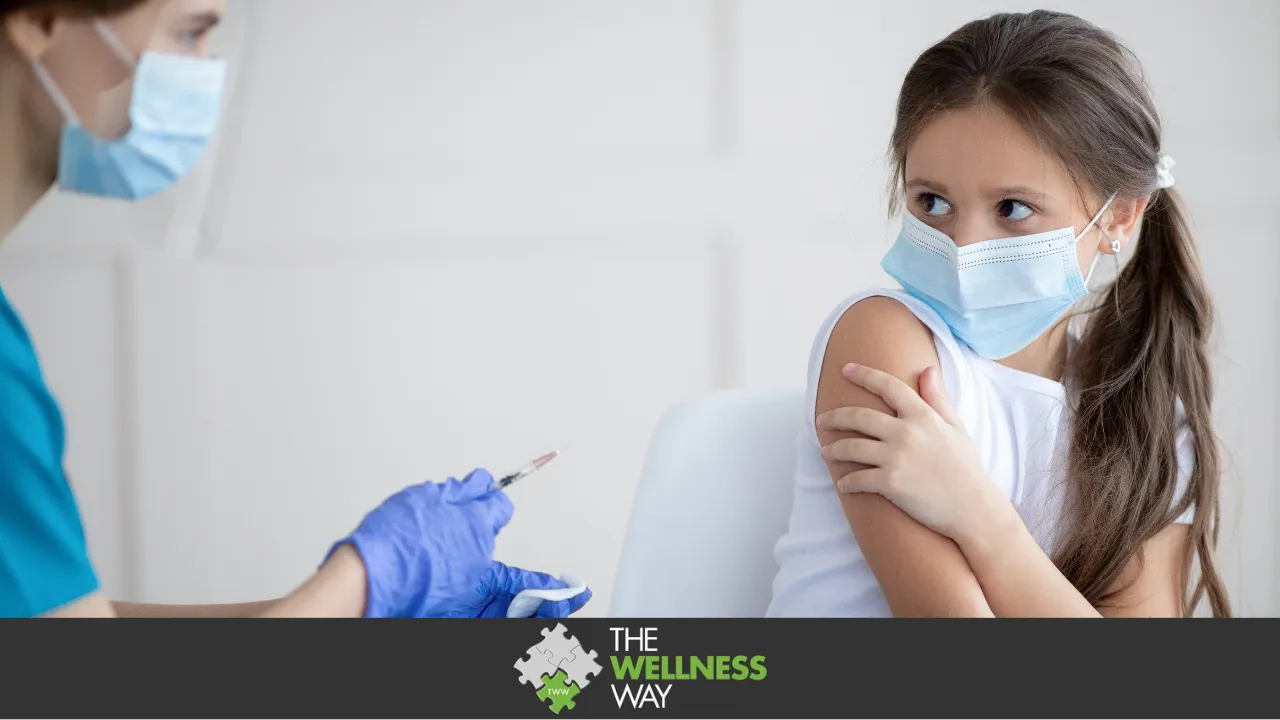 girl looking scared as a nurse holds a vaccine