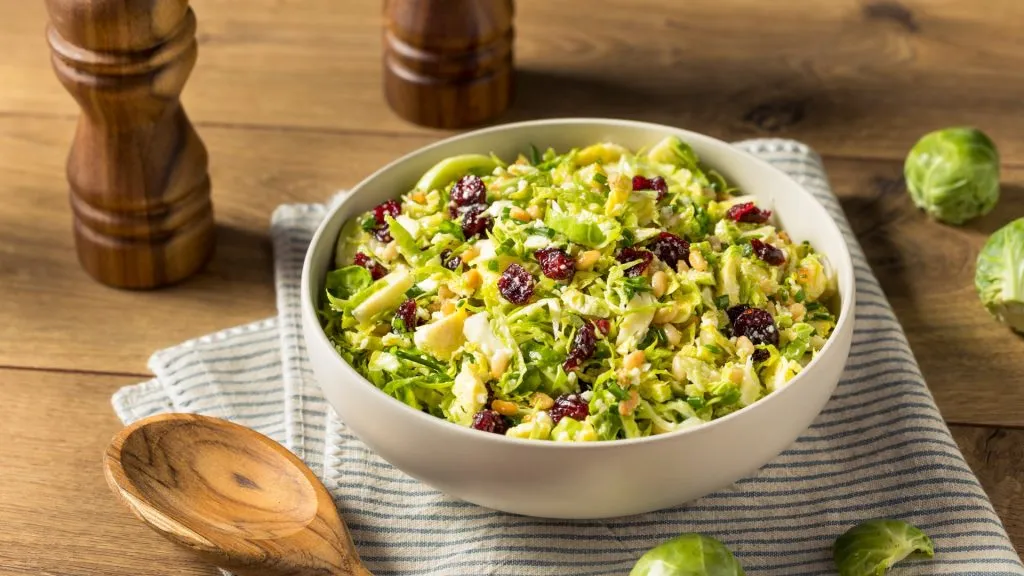 Homemade Brussel Sprout Salad with Cranberries, Nuts, and Bacon