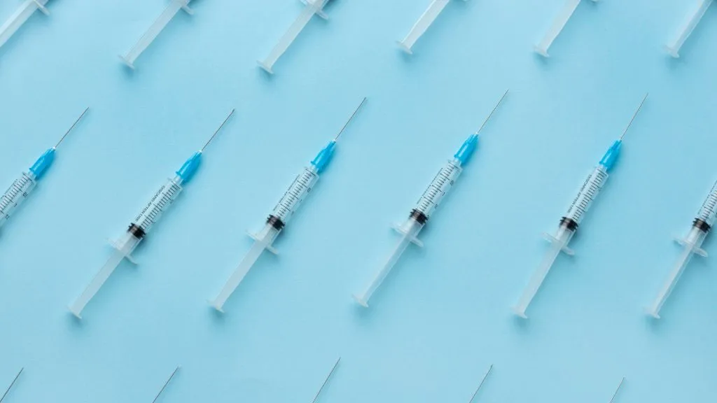 Vaccines on blue background