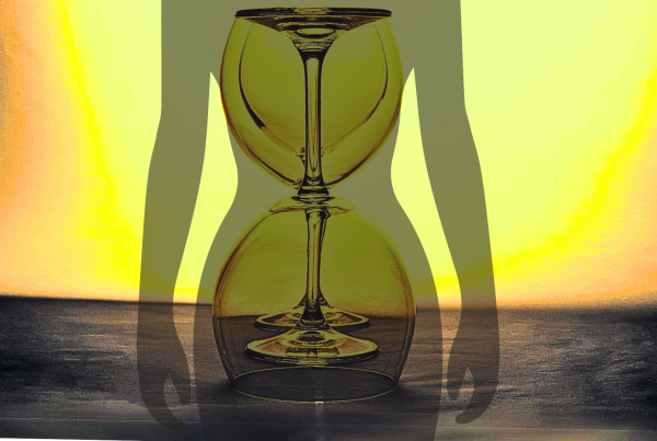 Wine glasses in the shape of an hourglass on top of a silhouette of a woman's figure to show curves
